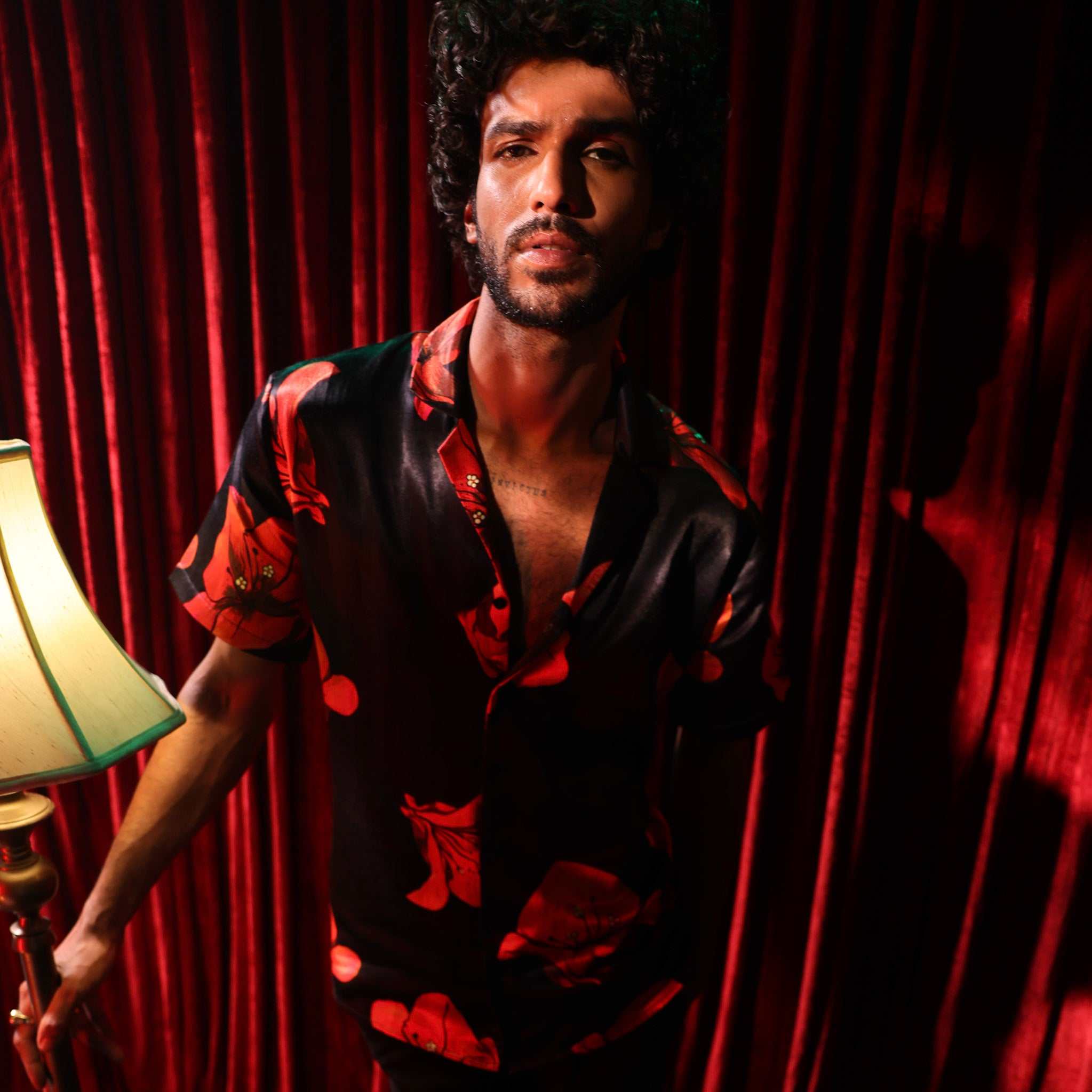 Model wearing Chinati Shirt , bouganvillea all over print on black, made of luxurious breathable Cupro fabric inspired by West Texas minimalism.