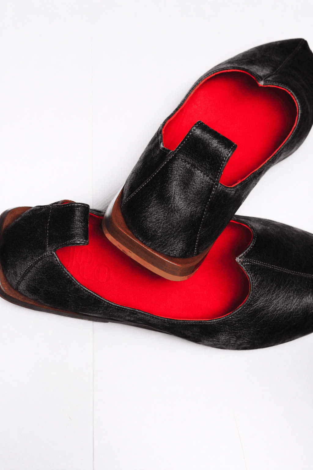 Close-up of men's hair design on handcrafted leather inspired by Indian Mojri craftsmanship