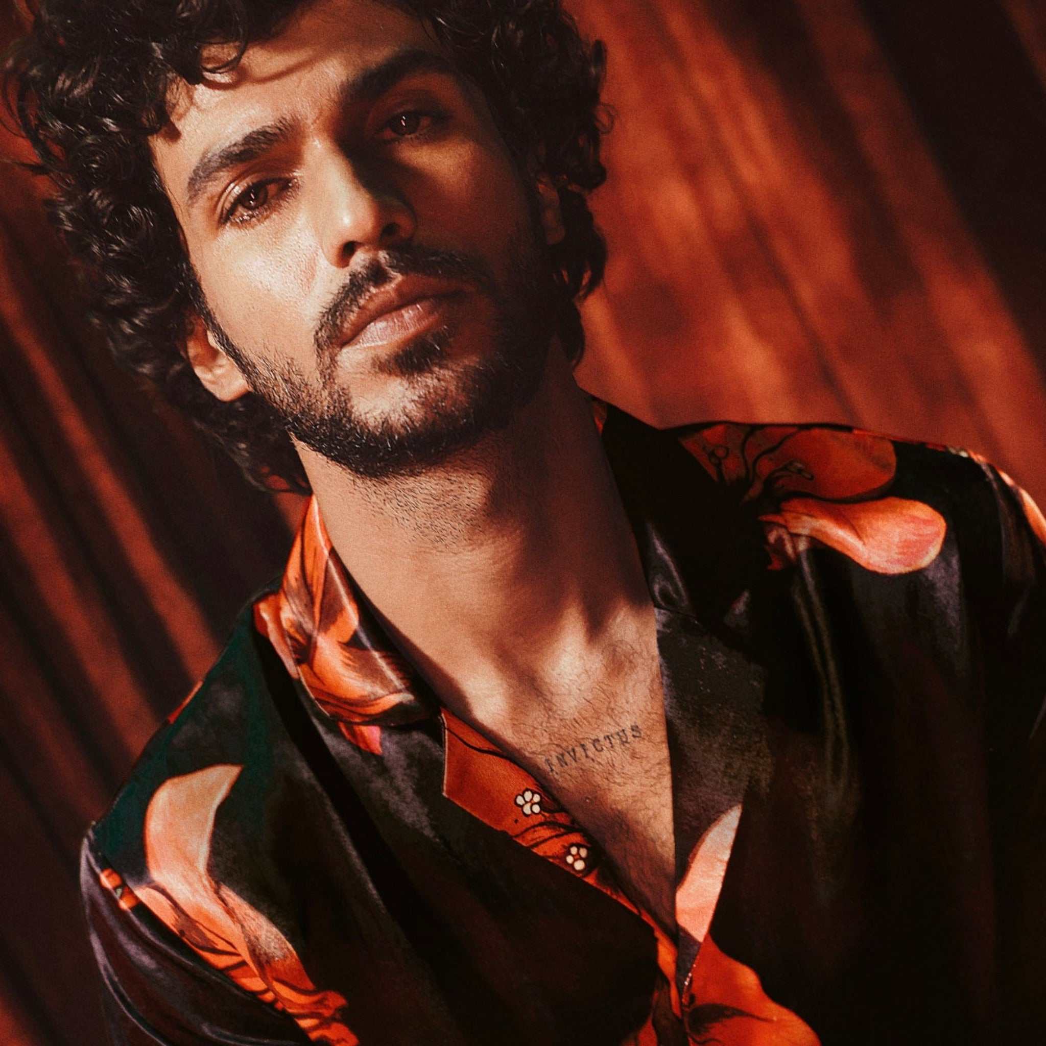 Model wearing Chinati Shirt , bouganvillea all over print on black, made of luxurious breathable Cupro fabric inspired by West Texas minimalism.