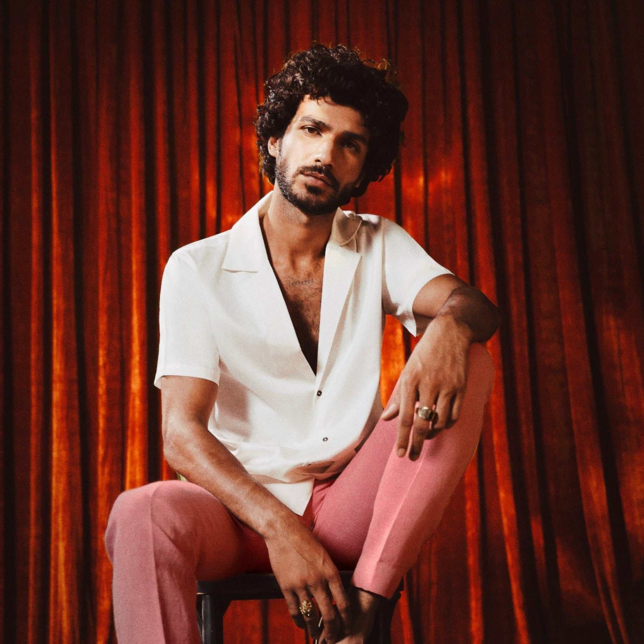 Ivory white slim-fit 10 Paisa Shirt with notch lapel, short sleeves, deep neckline, and custom coin-inspired buttons