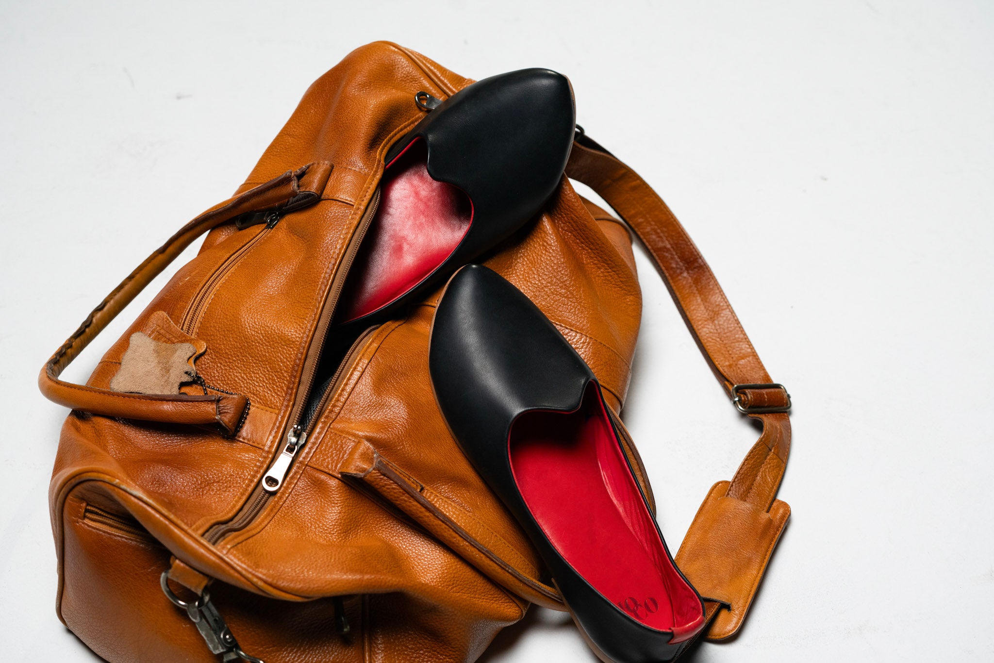 joco leather mojri's in a travel leather bag. 
